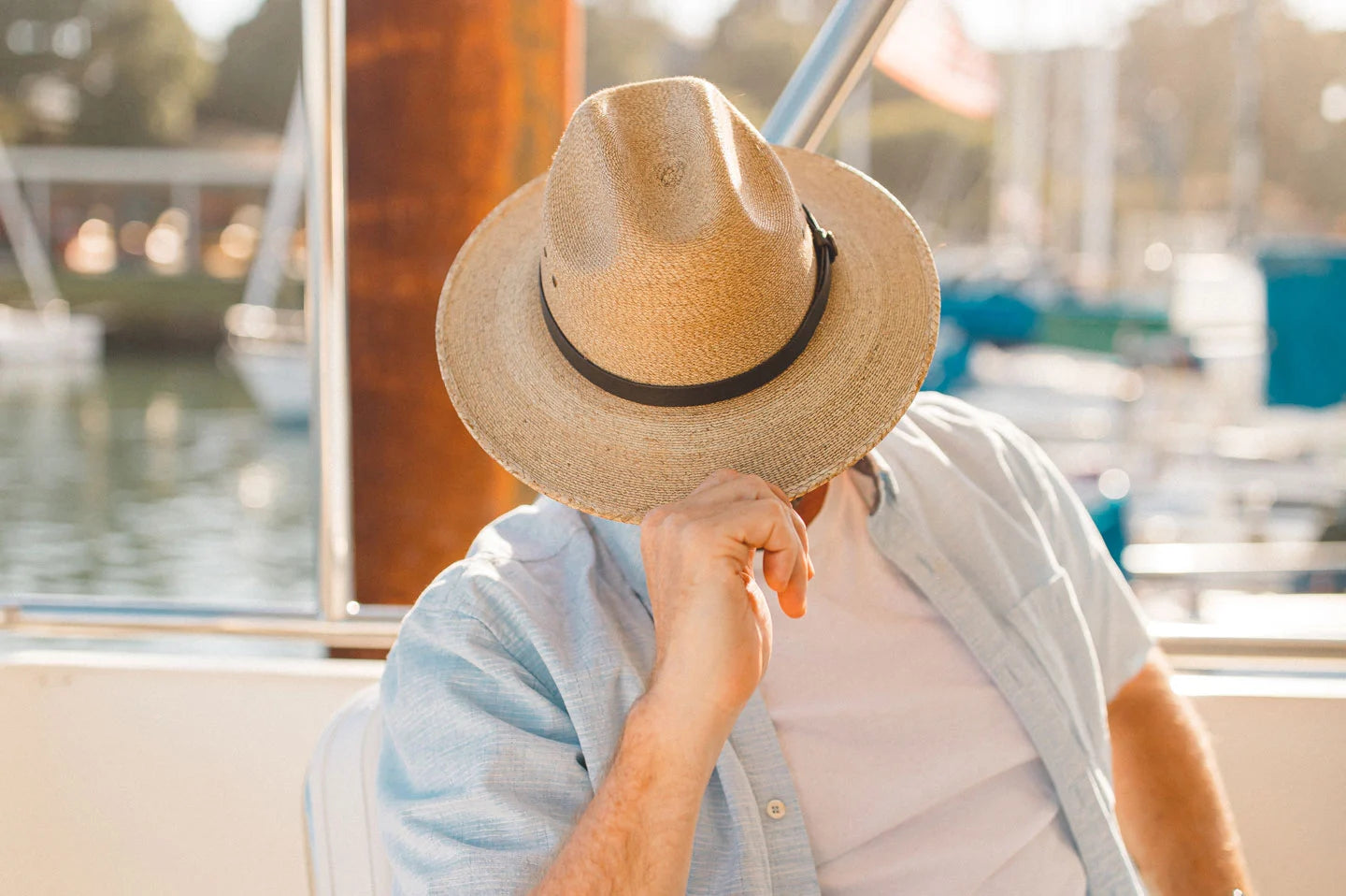 Man on boat wearing the Amarillo straw hat by American Hat Makers