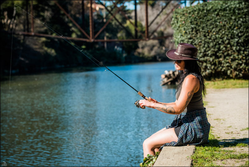 A man who goes fishing wearing a Bison leather hat