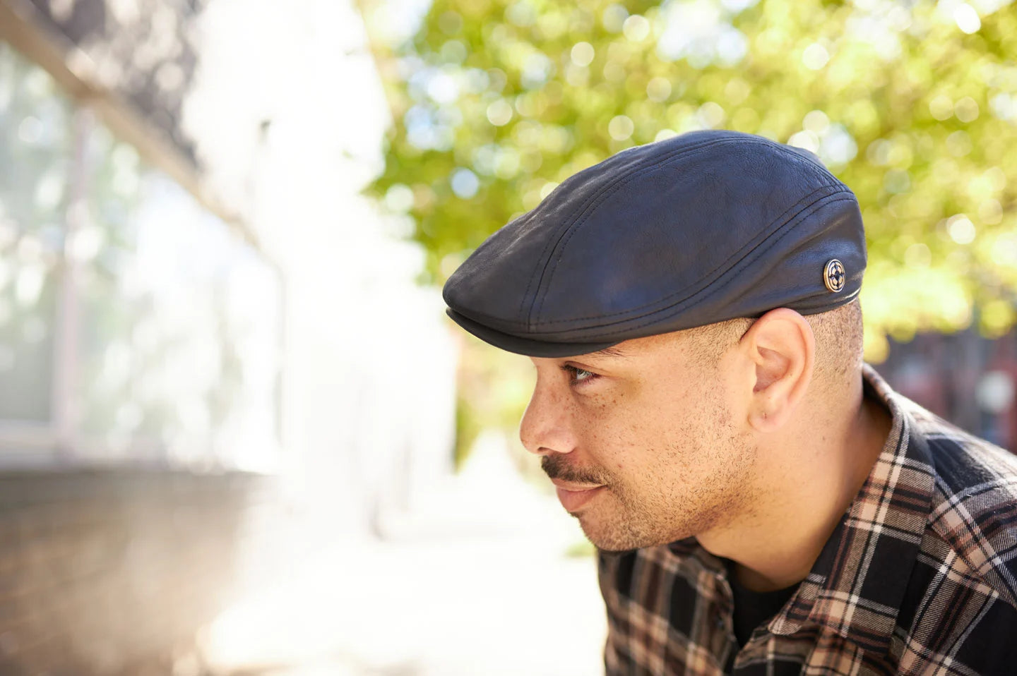 Man in park wearing the Bookie mens cap by American Hat Makers