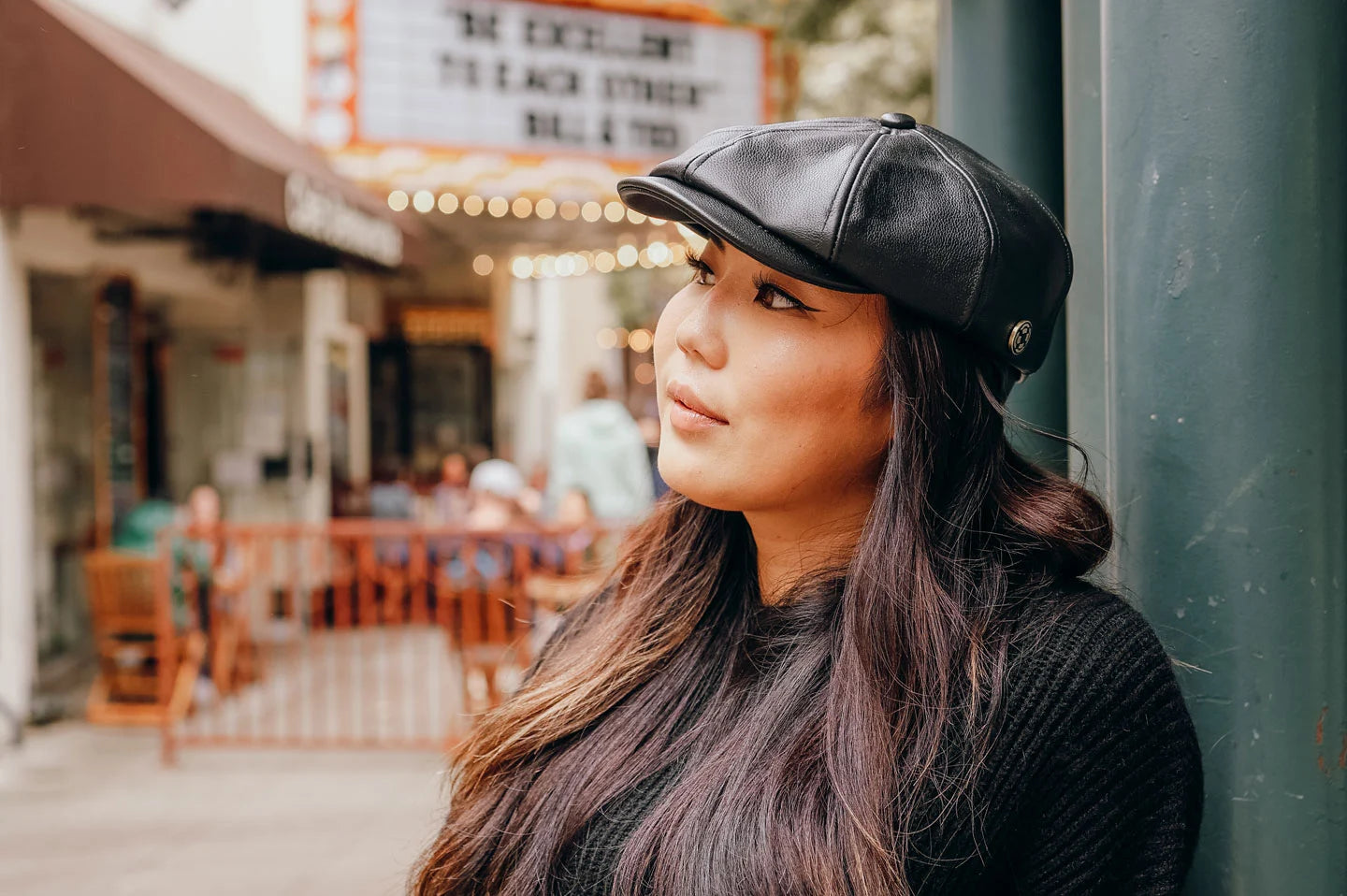 Woman in market wearing the Bourbon St womens cap by American Hat Makers