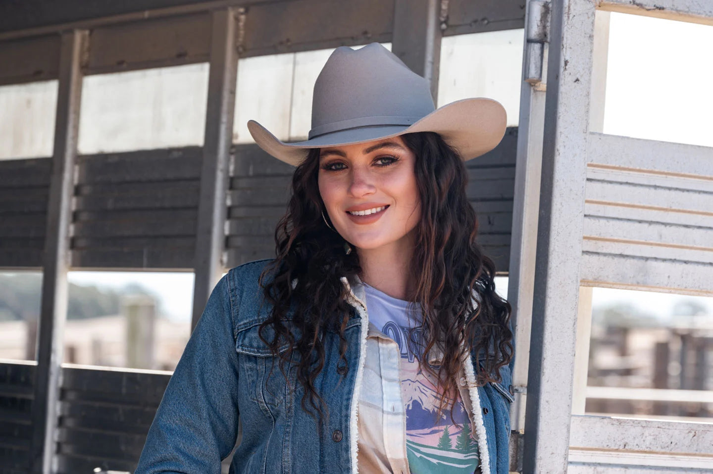 Woman in horse trailer wearing the Cattleman felt cowboy hat by American Hat Makers