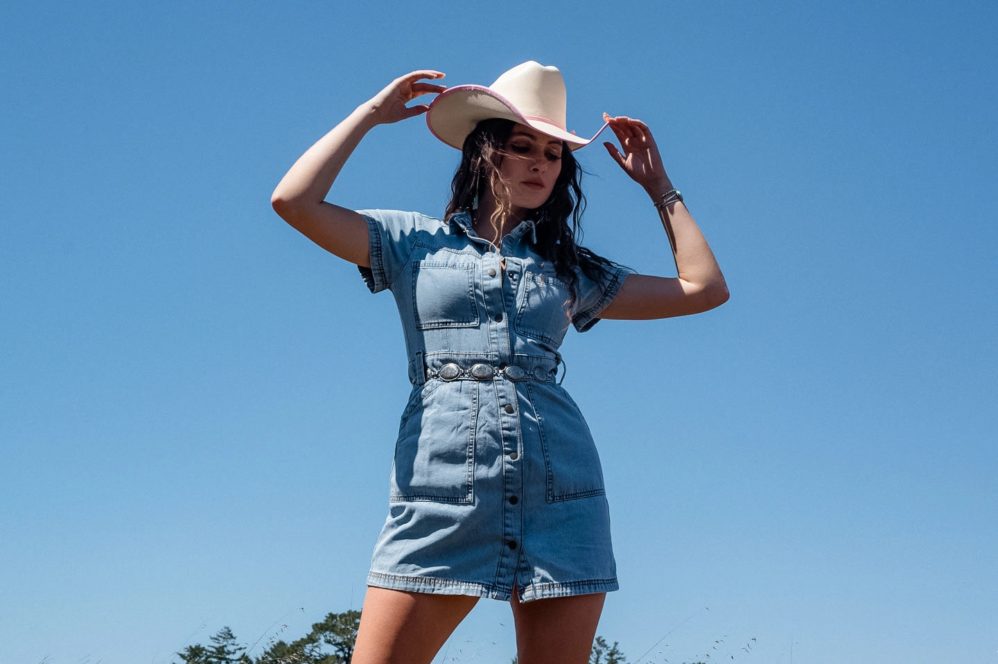 Woman posing in the Dolly cowgirl hat by American Hat Makers