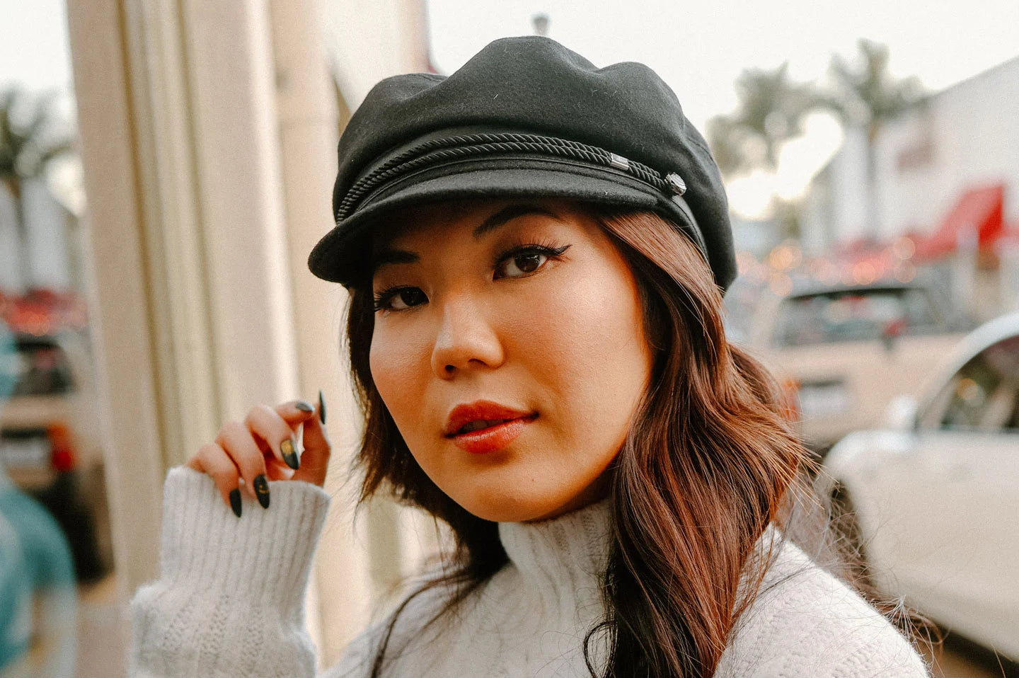 Woman wearing the Downtown womens cap by American Hat Makers