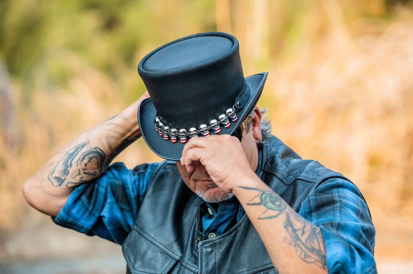 Biker man wearing the El Dorado Voodoo hatter top hat by American Hat Makers