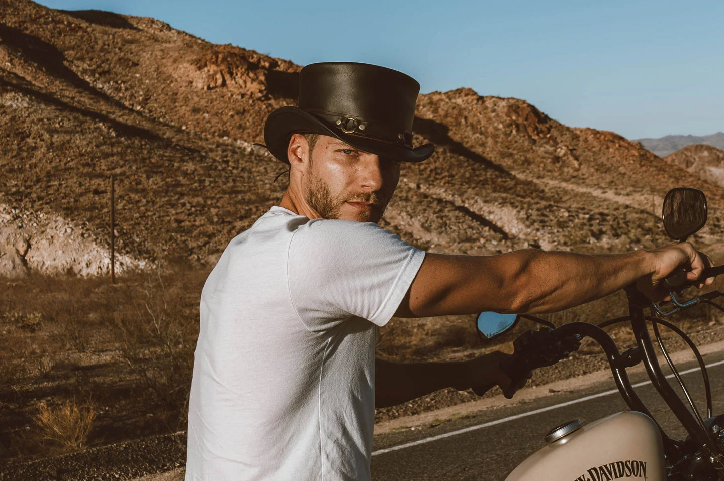 Man on motorcycle wearing the El Dorado SR2 black leather top hat by American Hat Makers