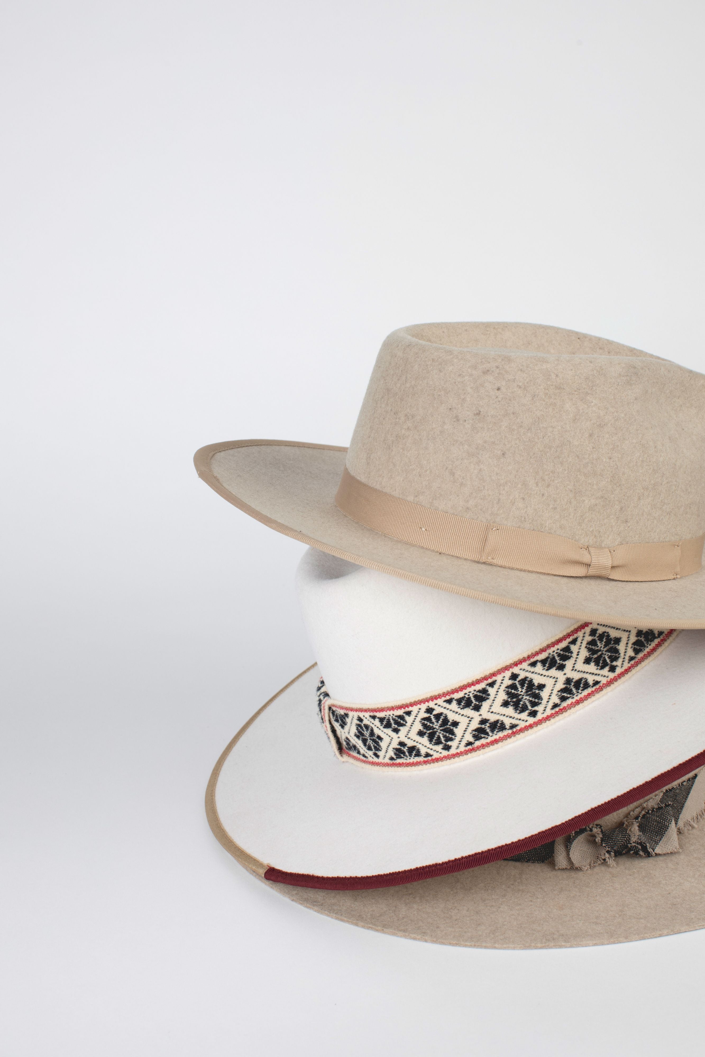 Two felt hats with different colors on top of each other