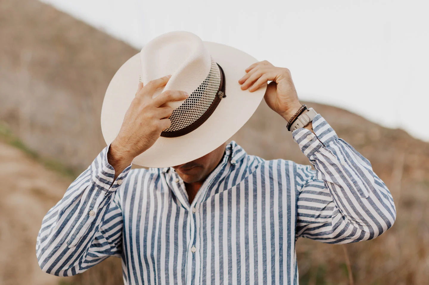 Man in field wearing the Florence mens hat by American Hat Makers
