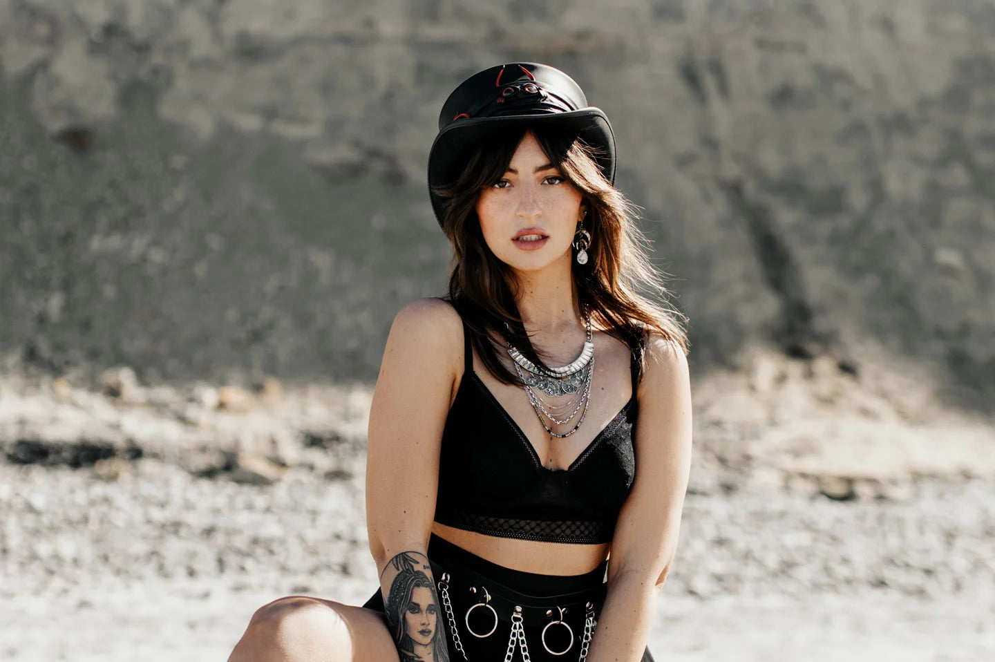 Woman in desert wearing the Marlow Lil Evil womens top hat by American Hat Makers