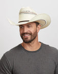 Man wearing a Ponderosa cowboy hat and a charcoal gray t-shirt