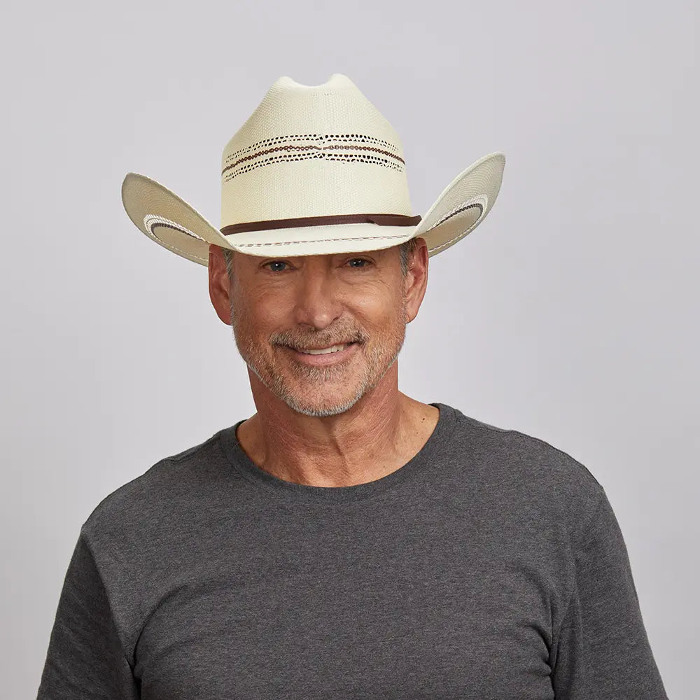 Middle-aged man with a friendly smile, wearing a Ponderosa cowboy hat and a charcoal gray t-shirt