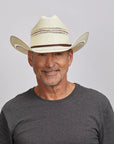Middle-aged man with a friendly smile, wearing a Ponderosa cowboy hat and a charcoal gray t-shirt