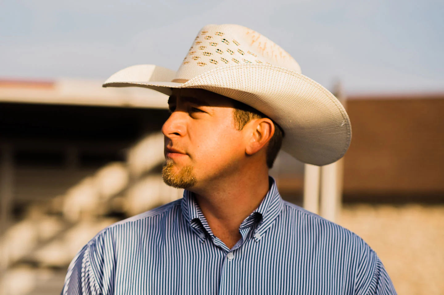 man in a western shirt wearing a ranger straw cowboy hat by american hat makers