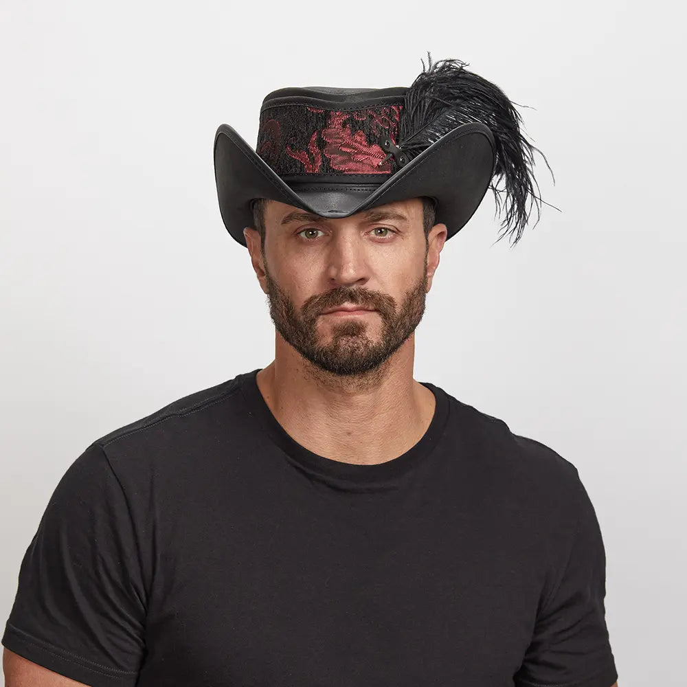 Man with a beard wearing a Reversible Ren Leather Hat, paired with a black t-shirt.