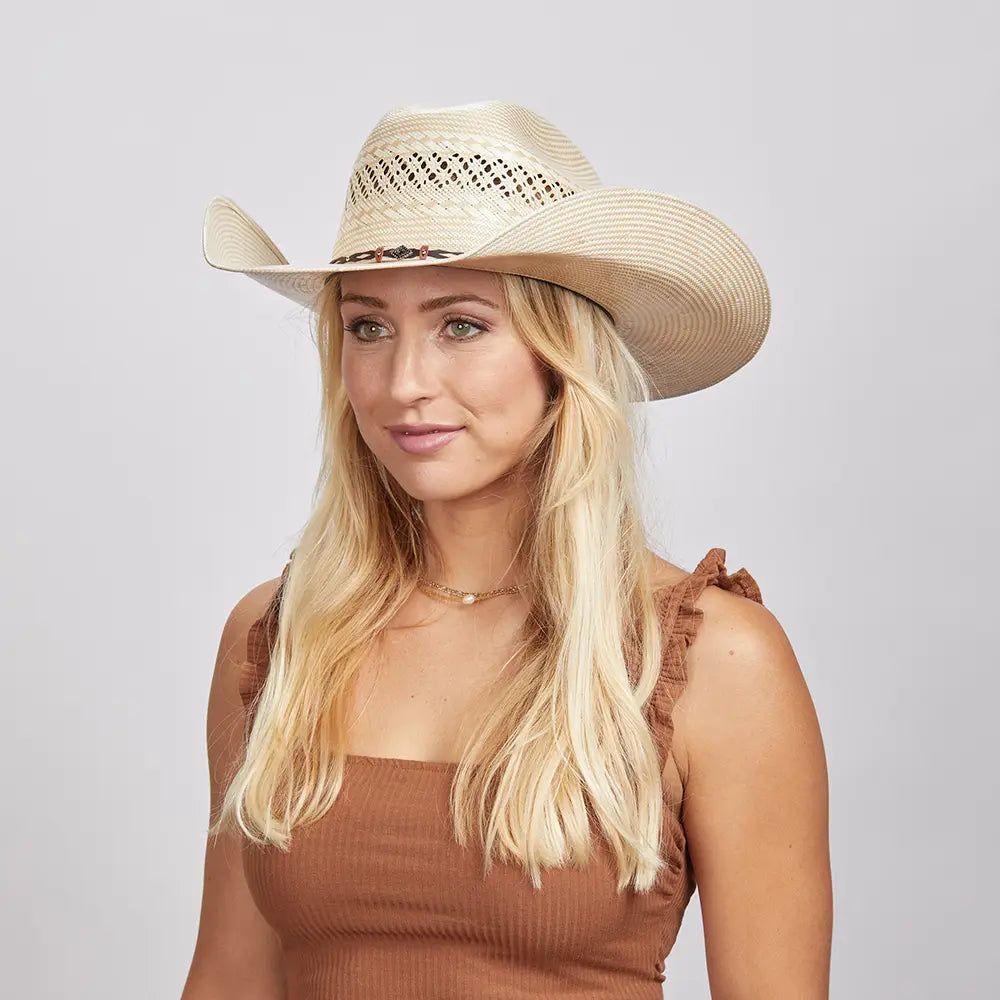 Blonde woman wearing a Roughstock Cowboy Hat and a brown tank top