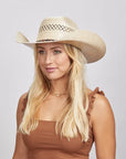 Blonde woman wearing a Roughstock Cowboy Hat and a brown tank top