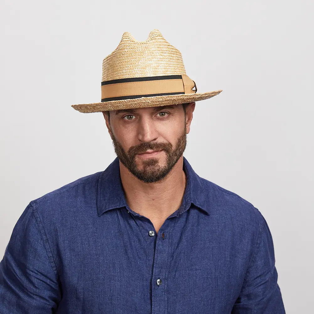 Man wearing a Sawyer Sun Hat and a blue shirt