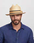 Man wearing a Sawyer Sun Hat and a blue shirt
