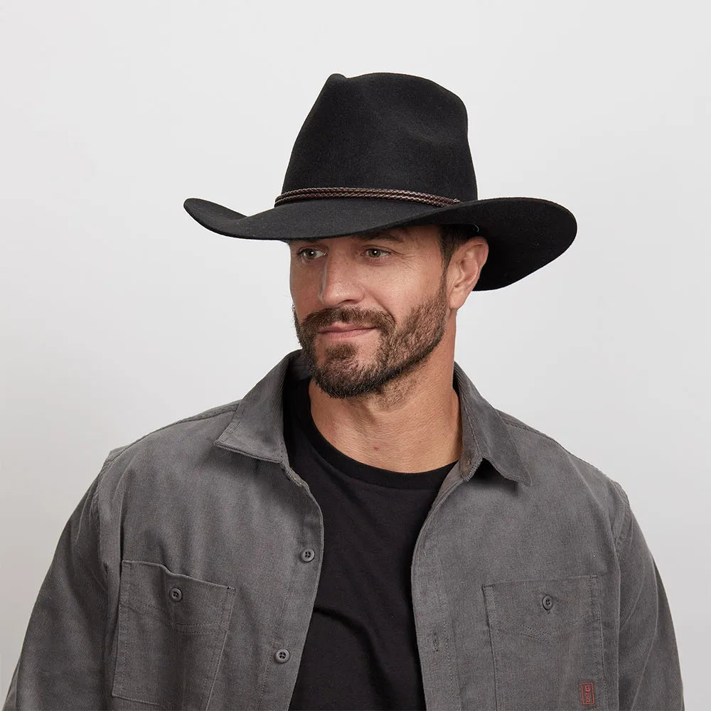 Man with a light beard wearing a Black Sequoia Cowboy Hat and a grey button-up shirt over a black t-shirt