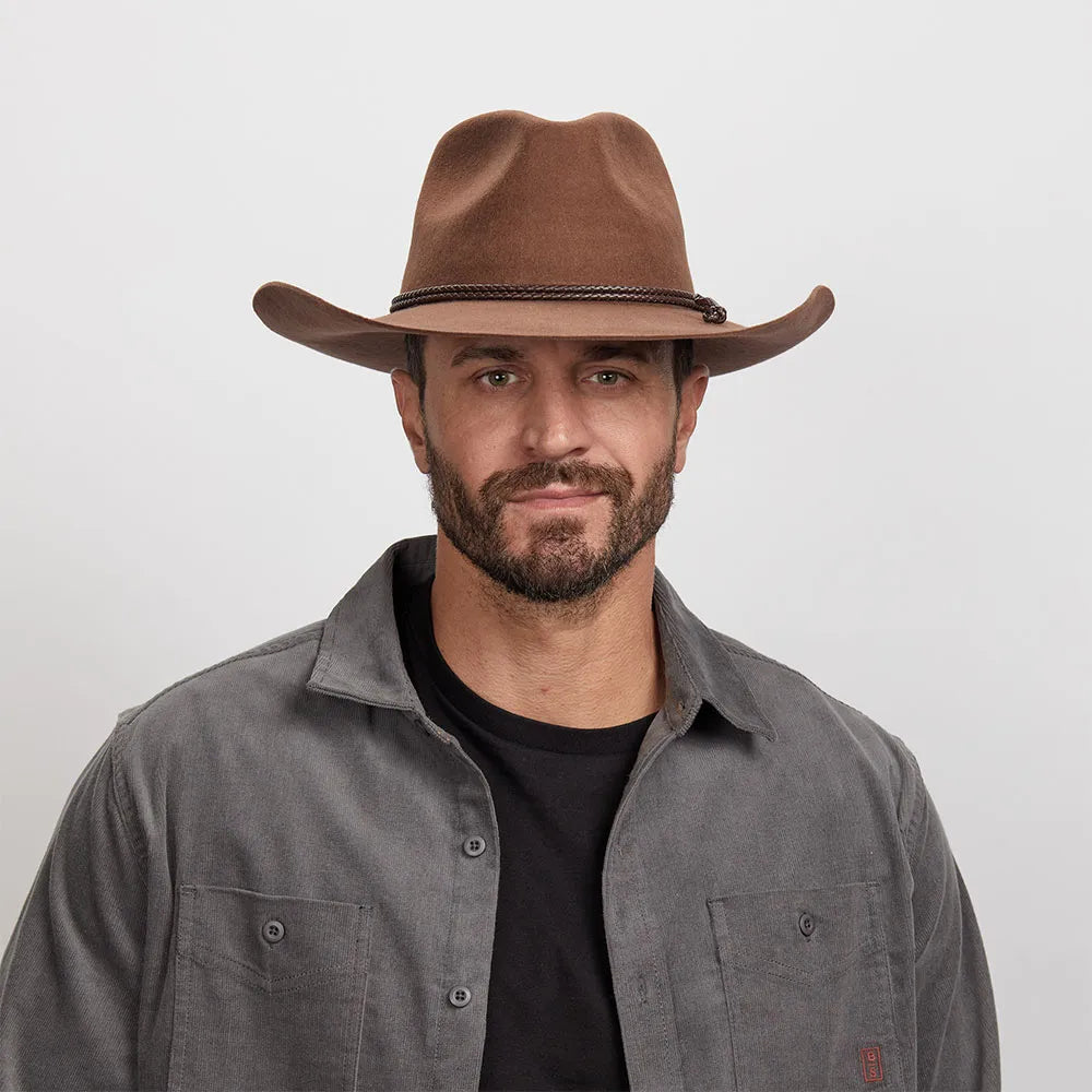 Man with a light beard wearing a Brown Sequoia Cowboy Hat and a grey button-up shirt over a black t-shirt