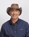 Middle-aged man wearing a Sierra Brown Cowboy Hat and a dark blue shirt