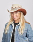 Smiling woman with blonde hair wearing a denim jacket and the Sierra Latte Cowboy Hat