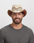 Man with a beard wearing a Sierra Latte Cowboy Hat and a gray t-shirt,