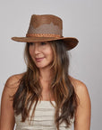 A woman with a dark hair wearing the Sirocco Copper Outback Hat