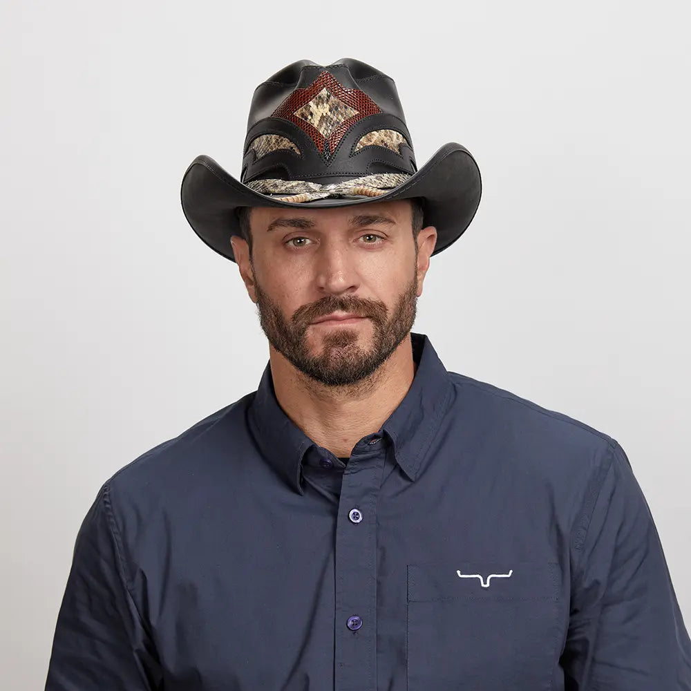 Man in dark blue button-up shirt wearing a Black Storm Cowboy Hat.