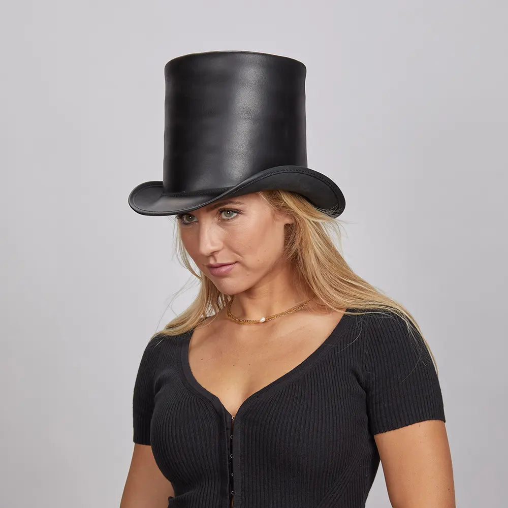 Woman wearing a black leather top hat with a confident expression
