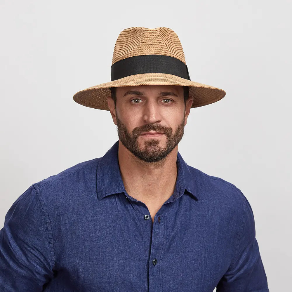 Man wearing a Beige Afternoon Sun Hat and a blue shirt