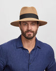 Man wearing a Beige Afternoon Sun Hat and a blue shirt