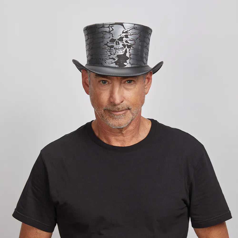 A man in his black shirt and black leather top hat