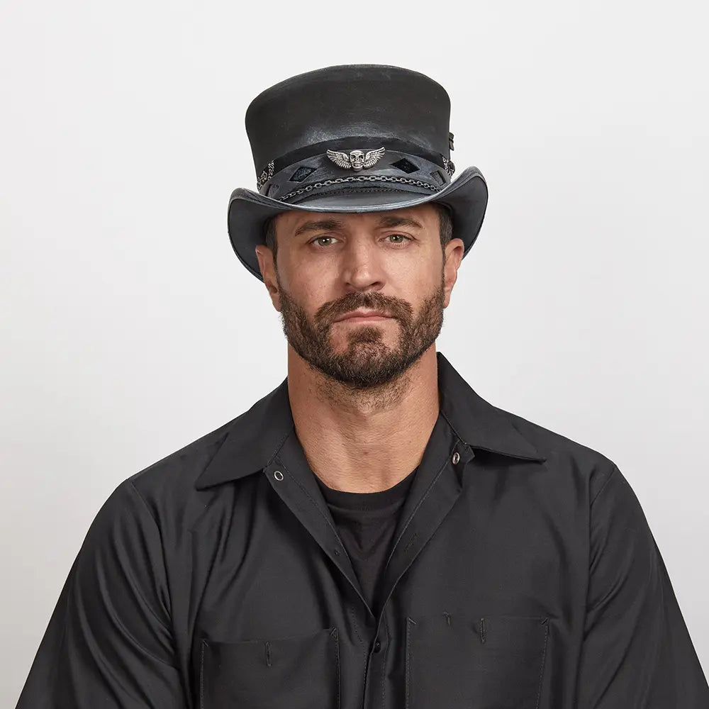 A man wearing a black polo and a black vector top hat