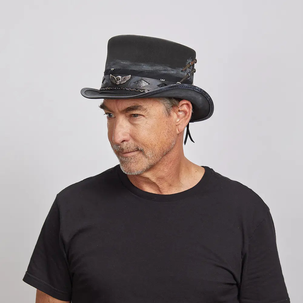 A man looking to the side wearing a black top and the Vector black top hat