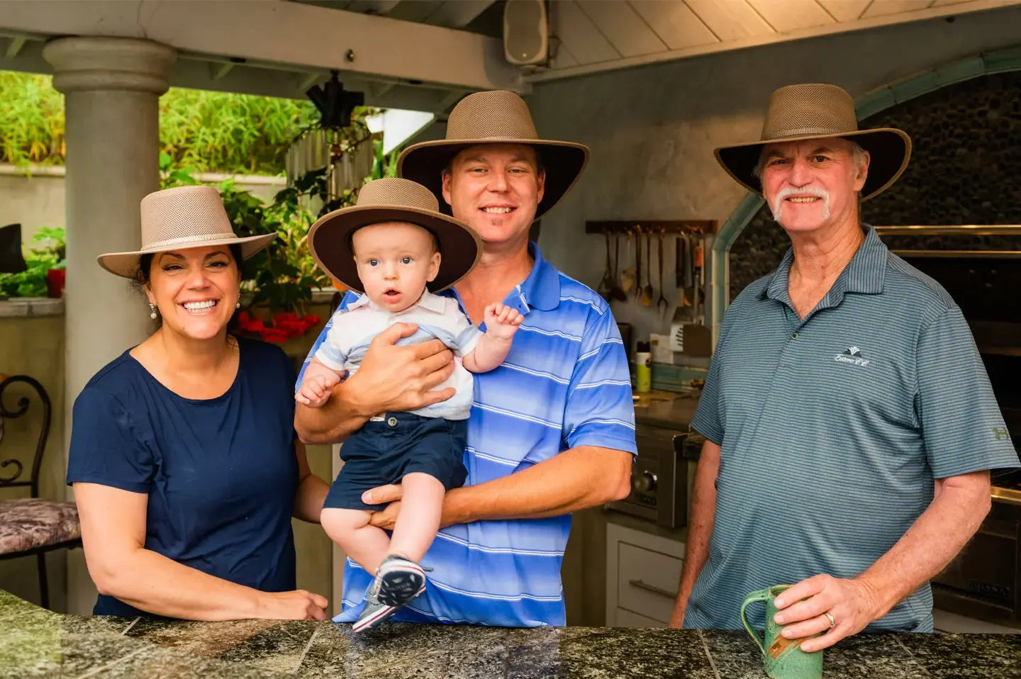 A family wearing brown colored hats