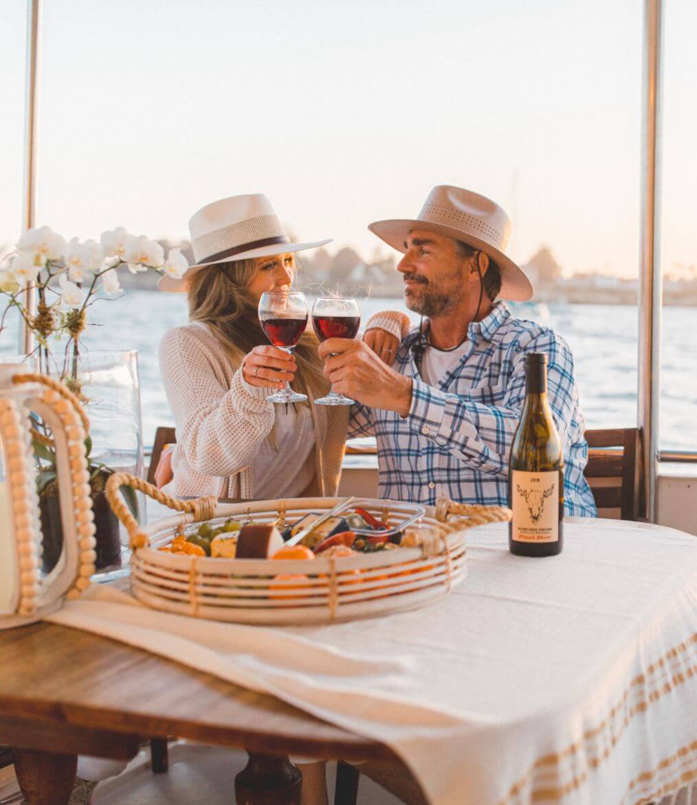 A man and woman celebrating wearing hats