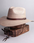 Right view of Barcelona Wide Brim Tan Straw Sun Hat on a stand