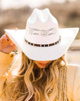 A woman with blonde hair wearing Billings Cream Straw Cowboy Hat