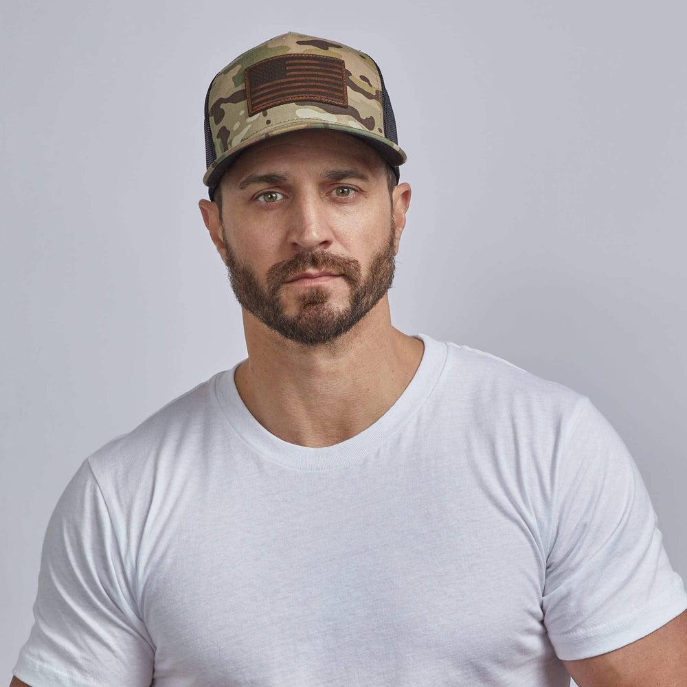 A man wearing Camo Snap Back Trucker Hat 