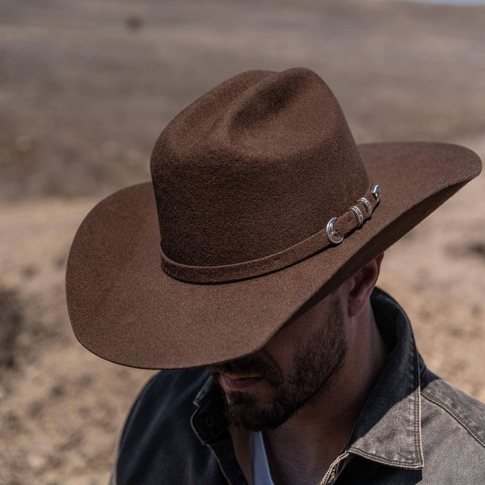 A man wearing Brown Cattleman Felt Cowboy Hat 