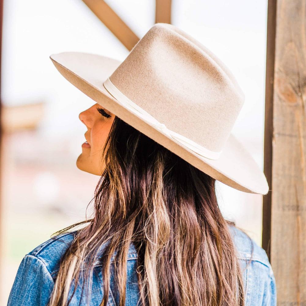 A woman in a back view wearing Crescent Oatmeal Felt Wool Fedora Hat 