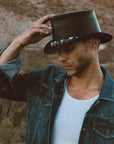 A man in denim jack and El Dorado Black Leather Top Hat 