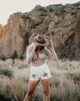 A woman wearing Hudson Bark Felt Fedora Hat