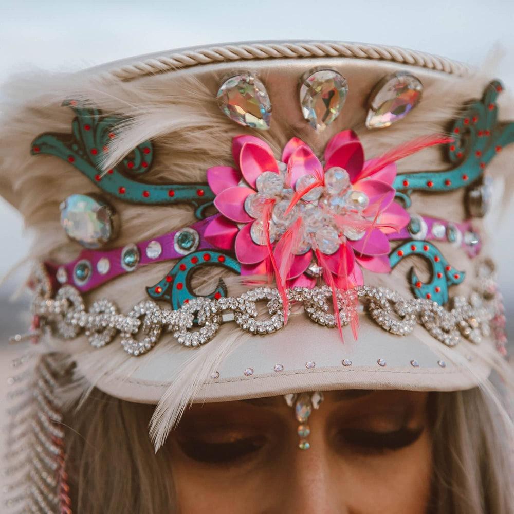 A woman wearing Lola Silver Burning Man Hat on a front view