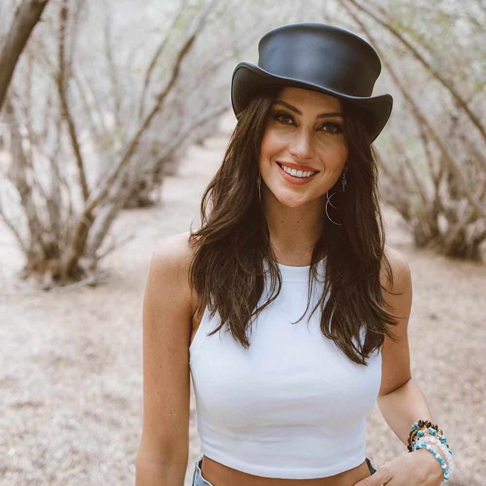 A woman wearing  Black Finished Top Hat