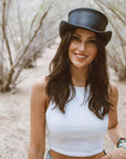 A woman wearing  Black Finished Top Hat