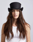 A woman wearing Unbanded Rogue Black Mesh Top Hat on a front view