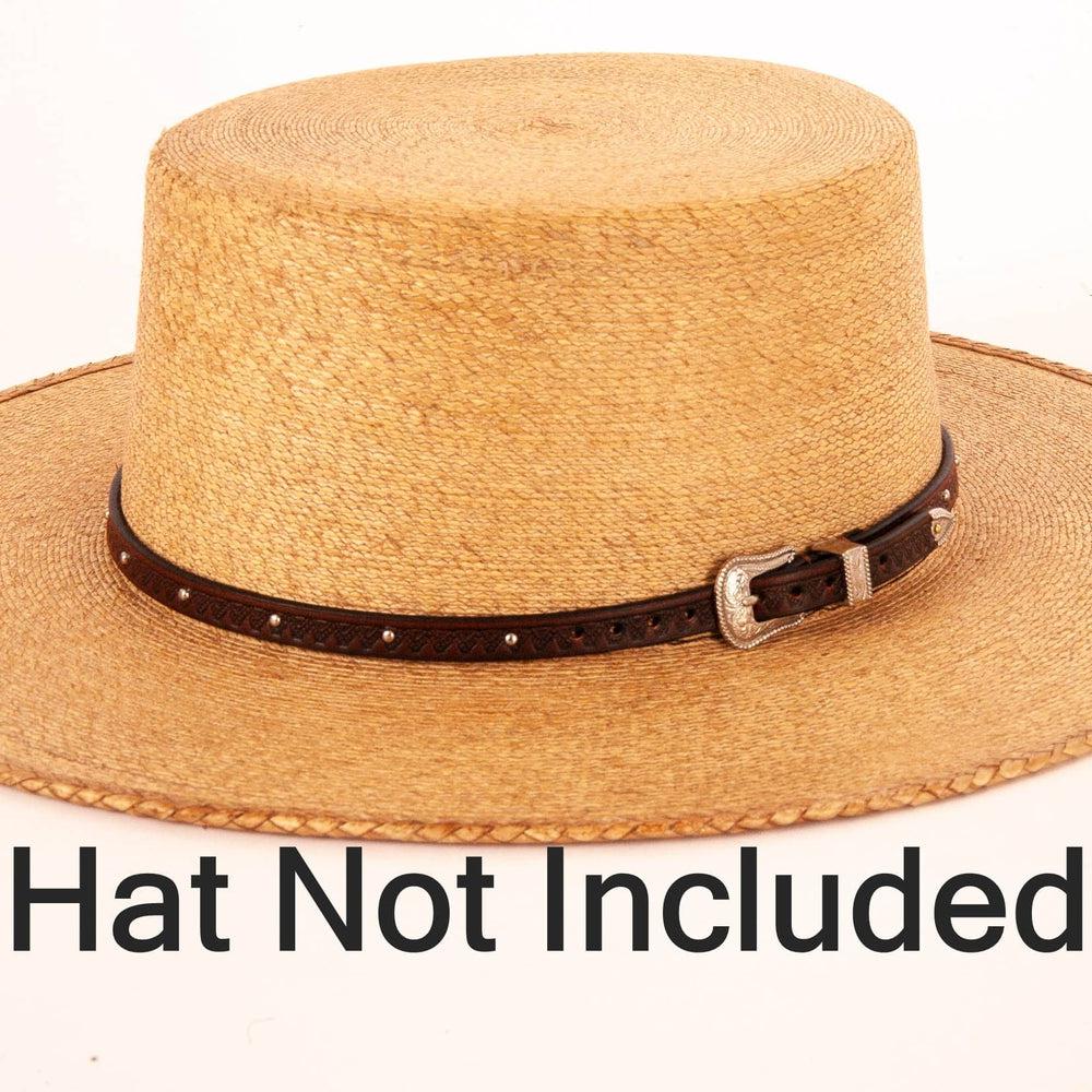 the colt tooled leather Cowboy hat band with silver buckle on a straw hat