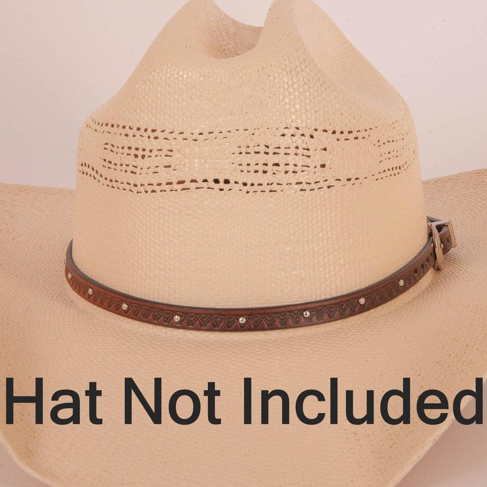 the colt tooled leather Cowboy hat band with silver buckle on a cowboy hat