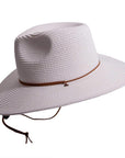 A side view of Felix white straw sun hat with chinstrap